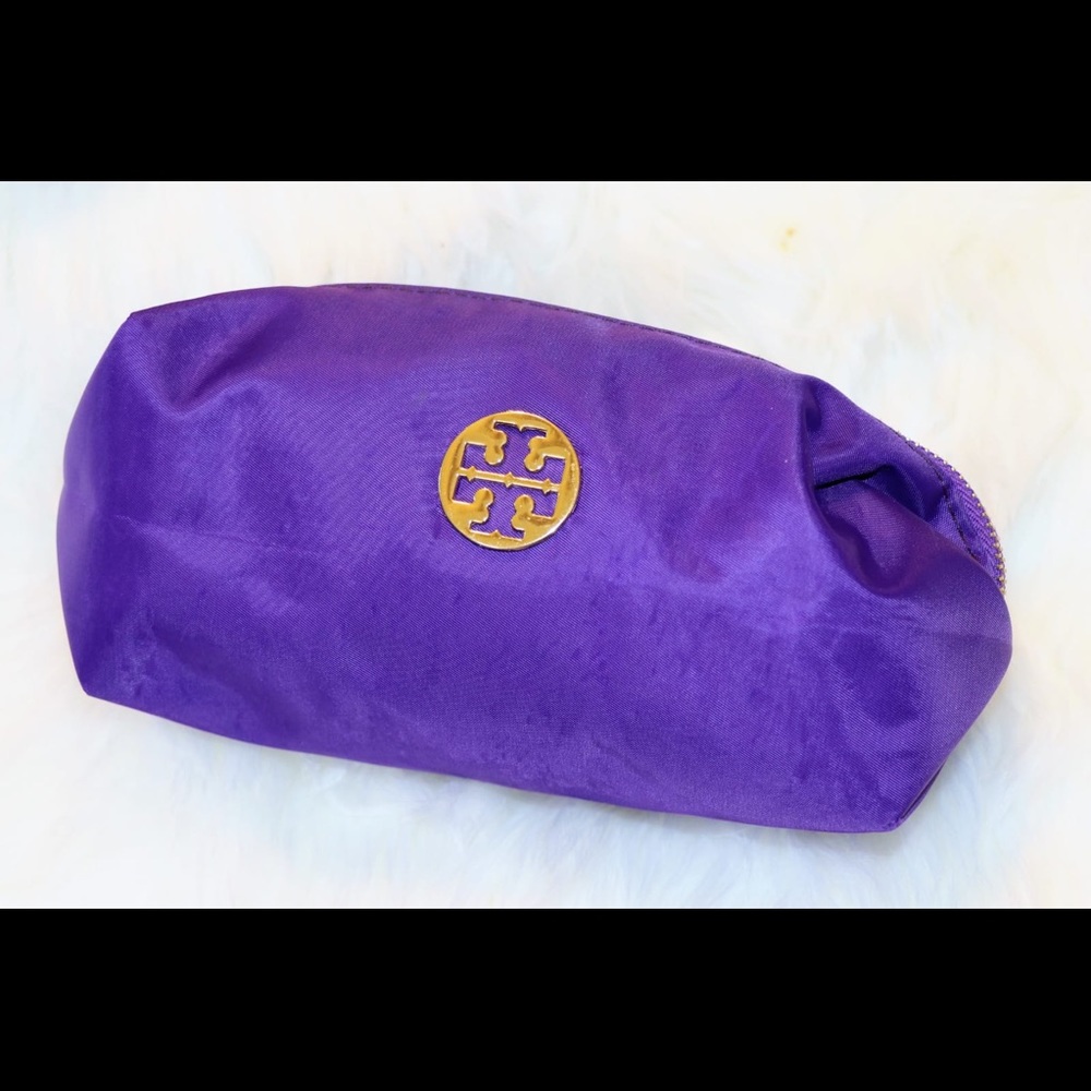 Cosmetic Bag. by Tory Burch. Purple bag.